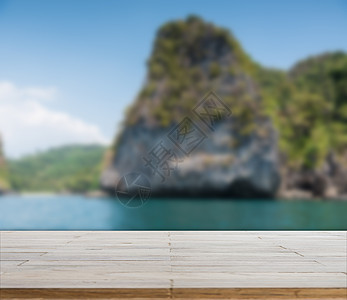 海滩背景上的木桌面或地板松树海洋热带太阳家具墙纸海岸产品天空蓝色图片