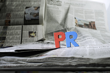 报纸上说PL营销宣传社会标签活动概念互联网顾客蓝色文稿图片