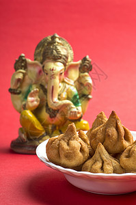 印度食品 Modak 与主甜菜贺卡设计的偶像宗教节日庆典卡片漫画崇拜上帝食物神话仪式图片