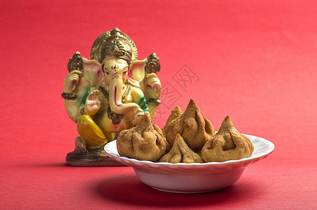 印度食品 Modak 与主甜菜贺卡设计的偶像卡片文化漫画仪式神话传统食物节日上帝执着图片
