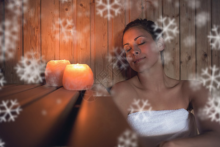 坐在桑拿室的棕发美女温泉长椅毛巾暴风雪水疗女士女性异国寒意奢华图片
