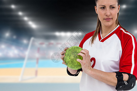 拥有一个球的女运动员播放器运动服闪光游戏场地女性手球女士竞技专注图片