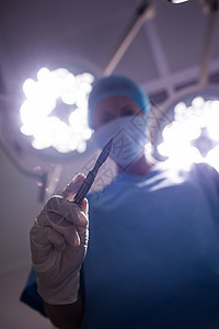 外科医生在手术剧院中进行手术住院医师检查器材手术帽医疗疾病工具职业诊所图片