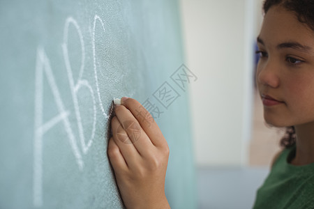 装作课堂老师的女教师兼教女学生女孩粉笔青春期技术智力学生中学黑板沟通互联网图片