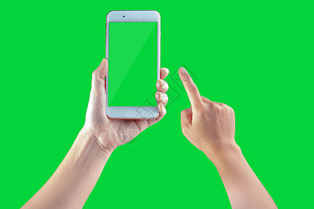 智能手机由一位女性持有 在绿色屏幕上图片
