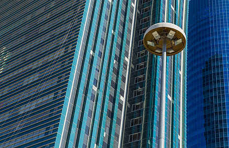 现代办公大楼建筑天际反射蓝色网格玻璃商业窗户市中心镜子图片