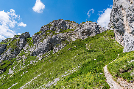在坦海默塔尔徒步旅行和攀登茅屋娱乐挑战顶峰草地蓝色山地行高山风险攀岩图片
