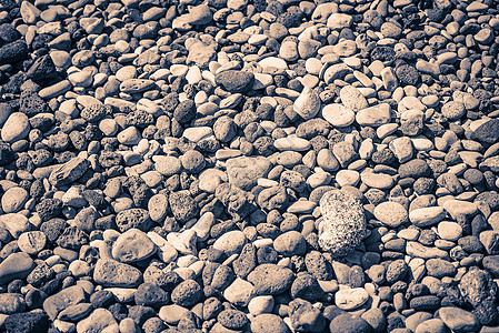 海滩上的石子卵石矿物巨石石头灰色花岗岩岩石圆形墙纸宏观图片