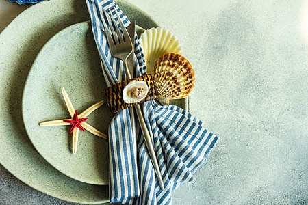 带有海星和贝壳的海洋表石器剥离海洋桌子餐巾盘子假期制品石头餐具图片