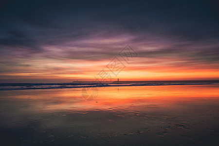日落海滩日出太阳阳光场景波浪反射季节海岸线天空蓝色图片