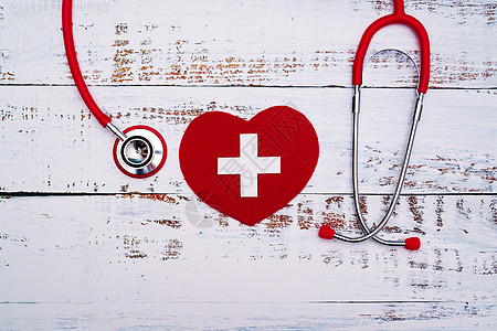 世界红十字日 红心与胸透镜放在木制桌上诊所病人疾病庆典治疗世界帮助医院卫生假期图片