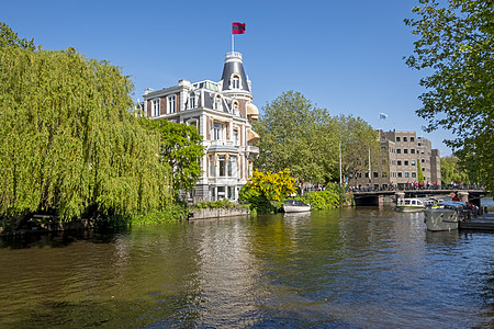 阿姆斯特丹内特尔河沿运河的房屋足球建筑学城市旅游国家国手荣誉首都庆典历史图片