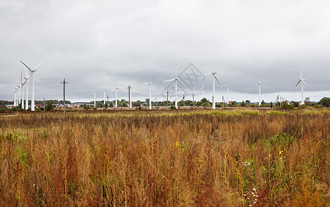现场现代风车发电机涡轮场地生产环境金属技术太阳天空生态图片