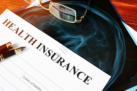 医疗保险政策概念 索赔表和表格上的X光片图片