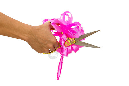 男子用剪刀和粉色弓砍手 隔离节日市场剪子庆典门厅套装磁带划分传统推介会图片