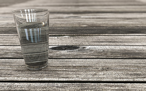 木桌透视背景上的一杯水图片