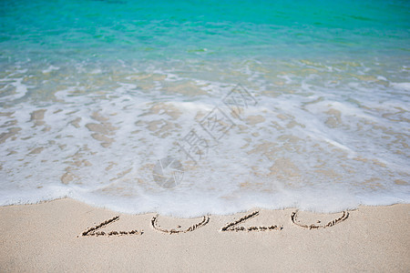 新年快乐 写在白沙里休息墙纸明信片热带海报假期新年太阳海浪季节图片