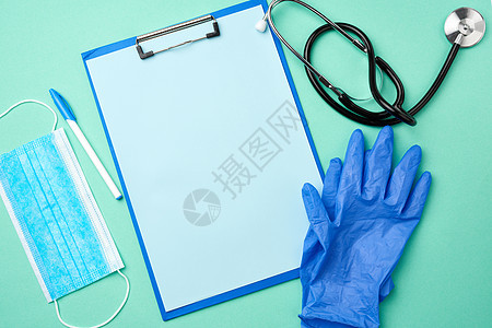 金属听诊器 有空白蓝页的纸持有者 答复安全卫生手套疾病面具保健测量外科衣服蓝色图片