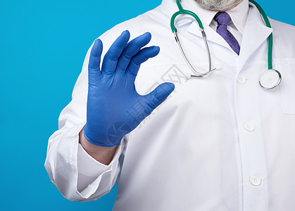 医生的手戴着蓝色无菌橡皮手套诊所注射器职业实验室安全护士手术保健男人治疗图片