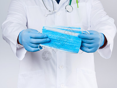穿白色大衣的医生 蓝色乳胶消毒手套挂着纺织男性工人护士成人外科疾病全科工作诊所病人图片