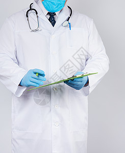 穿白色大衣的医生和蓝色医疗手套记录一名病人护士工作诊所文档医师工作室从业者医院卫生成人图片