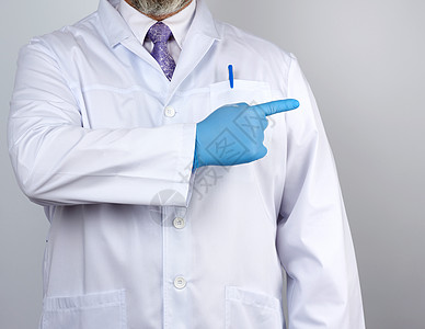 身穿白外套 带纽扣 手戴蓝衣的医务人员蓝色男人医院保健职业工作室药品治疗实验室棕榈图片