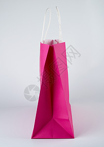 粉红色纸袋 白色背景上手柄的粉红纸购物袋顾客黄色零售商品店铺商业购物者展示礼物包装图片