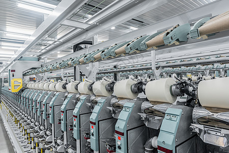 一家纺织厂的线条织物工具技术商业衣服羊毛加工旋转卷轴线圈图片