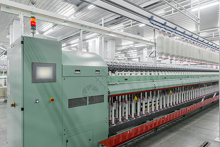 一家纺织厂的线条制造业衣服卷轴机械工作展示自动化加工线圈羊毛图片