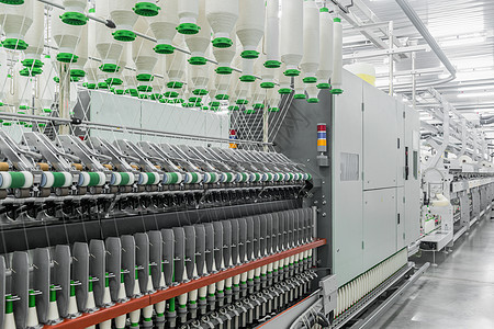 一家纺织厂的线条棉布纤维机器制造业材料生产技术旋转工作加工图片