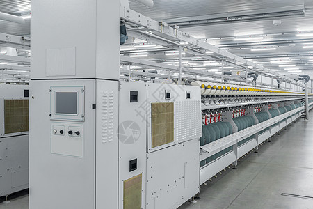 一家纺织厂的线条生产丝绸筒管设施材料自动化机器棉布白色机械技术图片