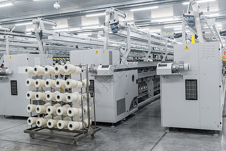 一家纺织厂的线条生产机械织物设施编织丝绸作坊纤维纺纱制造业羊毛图片