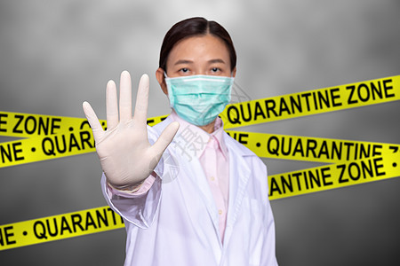 亚洲女医生佩戴医疗面具 举手阻止西格图片