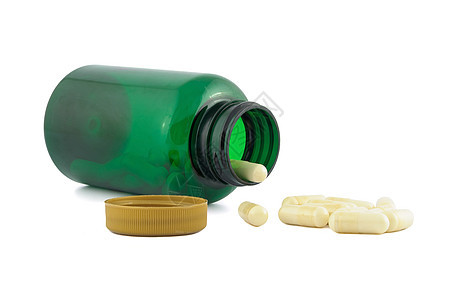 从绿色罐子里掉出的药丸图片