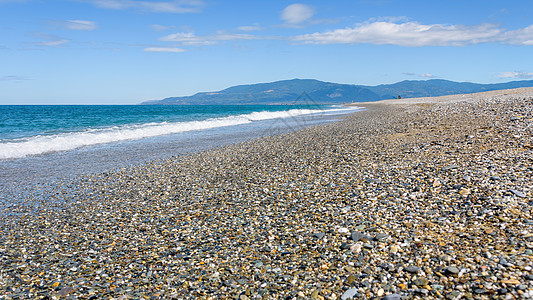 卡拉布里亚沙滩的景象海浪海岸蓝色海岸线鹅卵石泡沫海景碎石地平线波浪图片