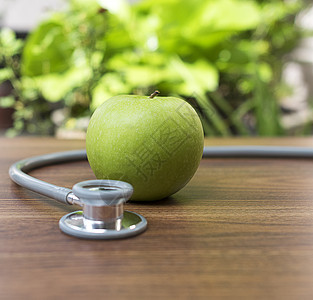 绿色苹果 配有健康概念听诊器卫生药品黑色医院图表病人生活疾病乐器医生图片