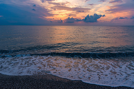 卡拉布里亚海滩日落风暴海景橙子地平线海洋海岸冒险支撑太阳假期图片