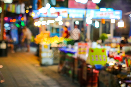 当地市场上中国城镇模糊多彩的浅光街道食品车辆旅游生活背景运输市中心旅行商店交通传统图片