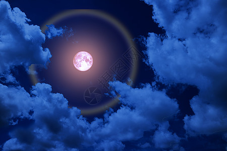 满粉红月光 月亮和彩色的夜云图片