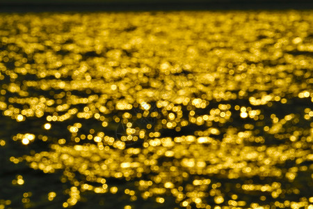 海水表面模糊彩光的金色抽象街道潮人背景反射阳光海浪假期旅行钓鱼海洋图片