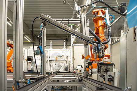 机械手臂工厂自动化生产线上的模具传送带背景