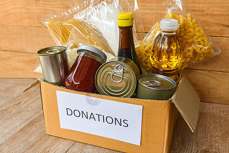 木制表格背景过去有罐装食品的捐赠箱志愿者杂货店饥饿大豆必需品送货食物盒子产品纸板图片