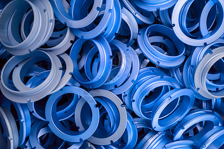 经典蓝色涂层金属环部件的抽象背景阳极圆圈氧化化学品合金技术硬件戒指工程车削图片