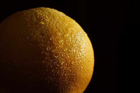 橙色水果 有黑色背景的滴子橙子甜点饮食圆圈热带皮肤果汁食物果味产品图片