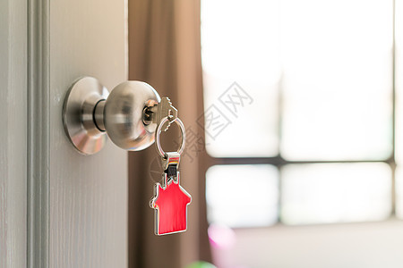 住宅和住房财产概念 打开大门的钥匙图片