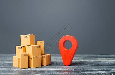 红色位置指针地理定位符号和纸板箱 配送配送货物 货运运输装运 物流和仓储 全球市场和业务 进出口宏观经济学生产出口库存贸易融资制图片