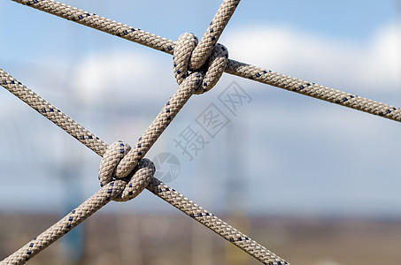 许多绳子和一条大结 紧紧闭着缆绳依恋绑扎吊带领带化合物电缆包容细绳线条图片