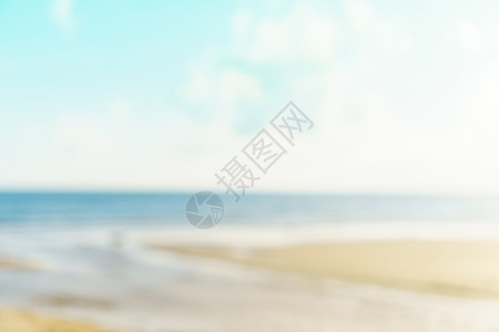 模糊的夏季散景海滩与阳光和蓝天蓝色太阳墙纸假期热带海洋天堂辉光晴天背景图片
