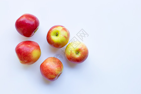 在白色背景隔绝的苹果 顶视图叶子剪裁橙子小路饮食甜点食物水果油桃团体图片