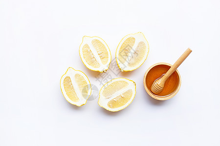 含柠檬的蜂蜜在白色背景叶子圆圈热带果汁团体水果食物生长框架橙子图片